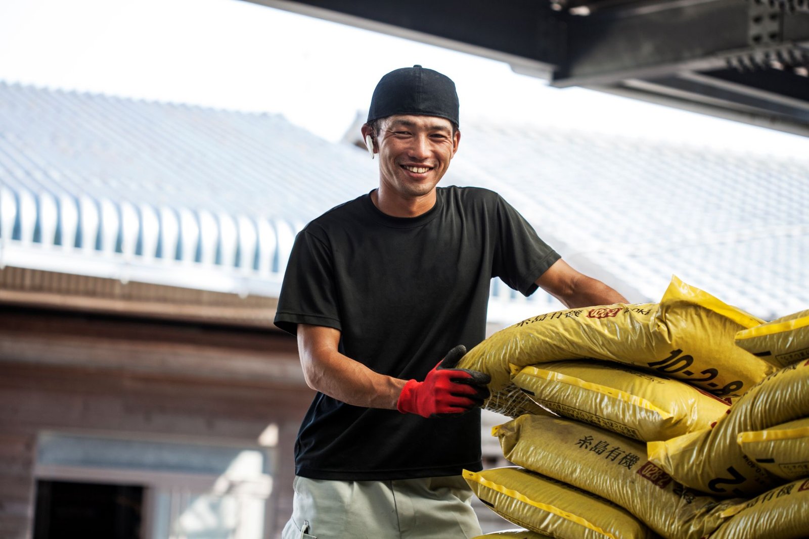 japanese-farmer-wearing-black-cap-standing-next-to-2023-11-27-04-57-35-utc.jpg